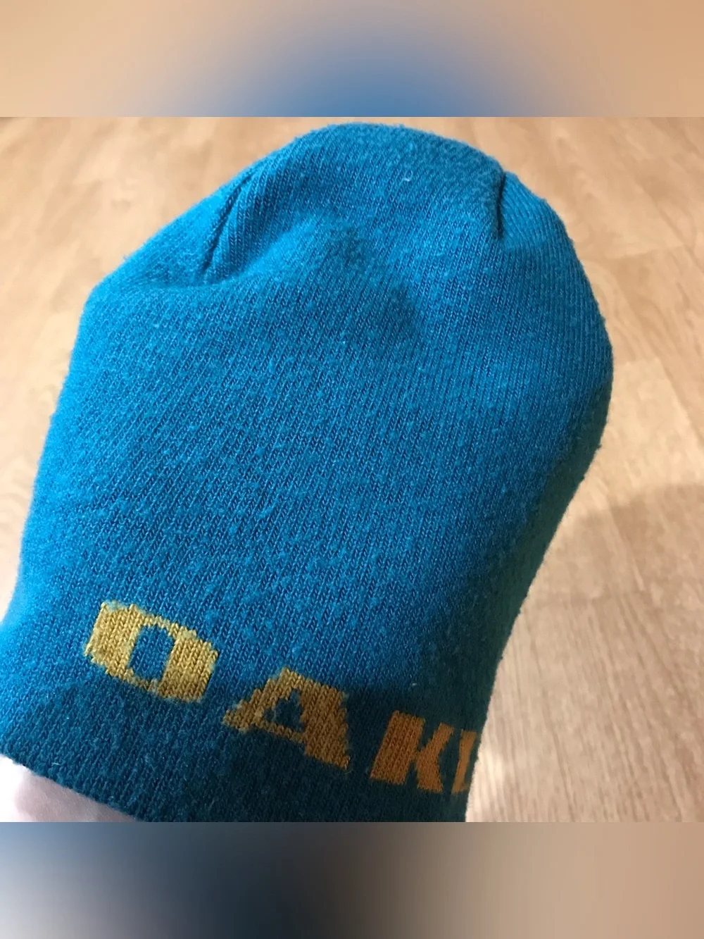 Vintage Oakley blue beanie hat with yellow logo